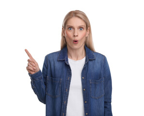 Surprised woman pointing at something on white background