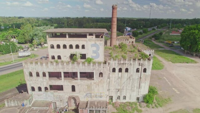 Revealing Shot of Abandoned Factory with Number Three in Ca&ntilde;uelas, Argentina
