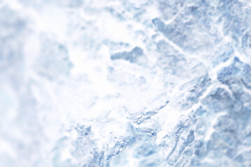 白い雪がかかるゴツゴツとした冷たい氷河岩石風テクスチャー