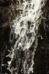 High shutter speed reveals patterns in a splashing waterfall.