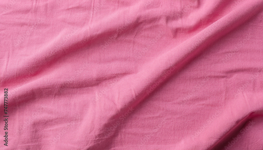 Poster texture of pink crumpled fabric as background, closeup; stock photo with copy space and empty place 