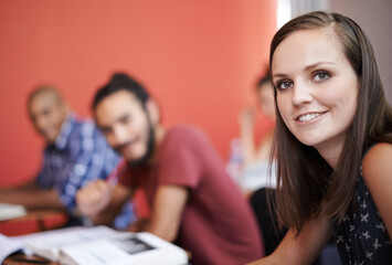 Portrait, university and students in a class, woman and knowledge with books and studying. Face, friends and group on campus with learning and education with support and exams with notes and smile