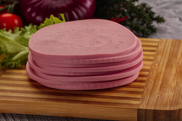 Boiled pork sliced sausage stack © Andrei Starostin