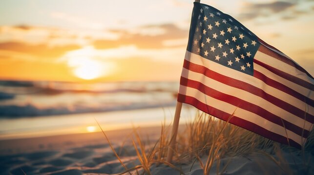 A serene beach scene at sunset, featuring the American flag fluttering in the breeze.