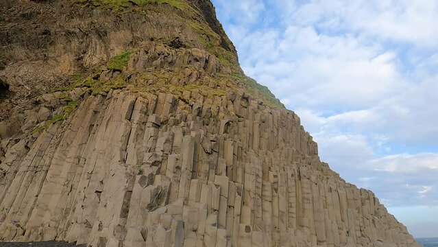 Hexagonal basalt columns at Halsanefshellir Cave on Reynisfjara Black Sand Beach, Iceland