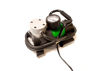 Car air compressor with manometer isolated on a white background
