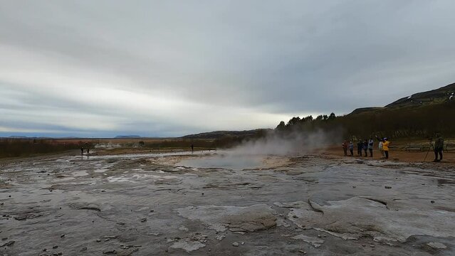 Strokkur geyser steaming in Haukadalur geothermal area of Iceland