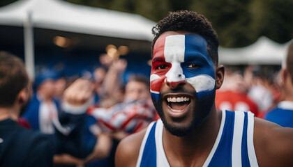 Sports fan cheering with passion and enthusiasm with national flag face paint in a crowd in a stadium for a football competition - obrazy, fototapety, plakaty