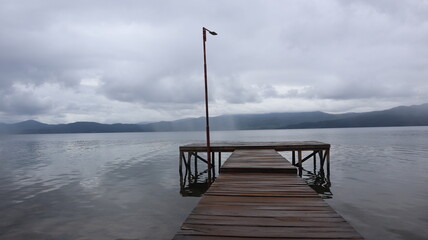 wooden pier on Lake Matano, Sorowako, South Sulawesi. Indonesia