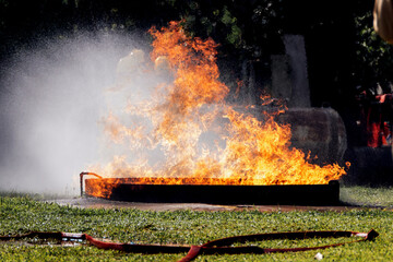 Fire flame in a firefighting training exercise. Firefighter training Concept.