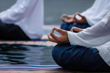 Closeup view of group of Muslim men meditating in mosque - obrazy, fototapety, plakaty
