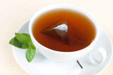 Steaming hot tea with a single tea bag