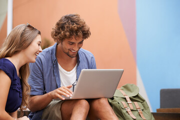 College students, smile and happy together with laptop laugh, discuss ideas and work on campus....