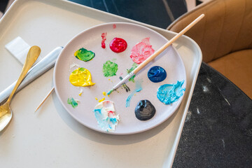 Paint Palette with paints and brushes,child's wood Painting Palette  with multiple colors,Photo of a wooden artists palette.