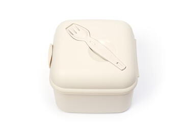 Plastic food container with built-in fork and gravy boat.