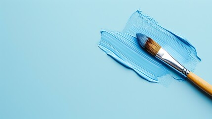 **Image Description**  A blue brushstroke on a blue background. The brush is resting on the paint.