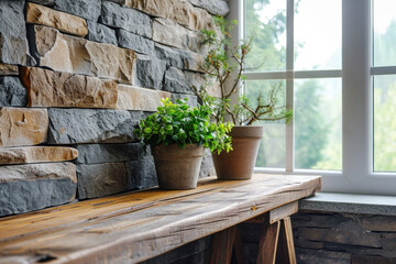 Potted plants on wooden ledge in modern stone wall interior. Home decoration and design.