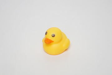 Yellow bath ducky from the front angle on a white background   