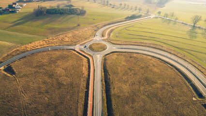 a roundabout connecting several roads including a highway and an expressway on a beautiful sunny day, architecture and infrastructure - obrazy, fototapety, plakaty