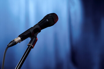 Microphone of comedian of stand up club or person invited for popular evening show standing on...