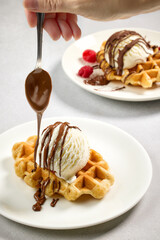 plate of belgian waffle with ice cream