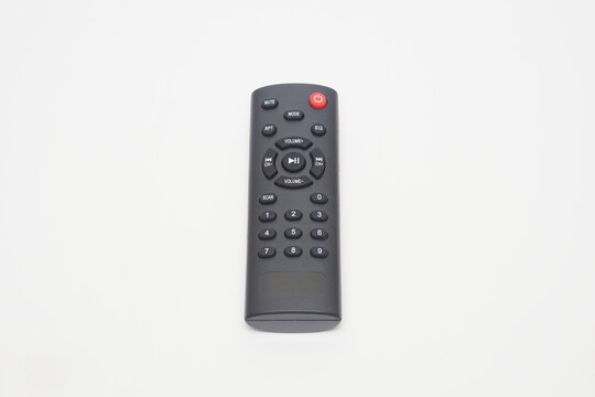 a black remote music player flat lay on a white background  