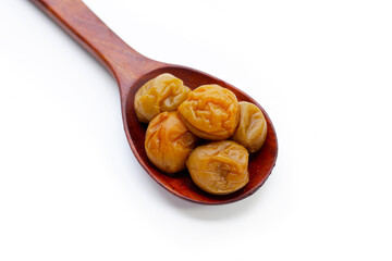 Pickled plums on white background.