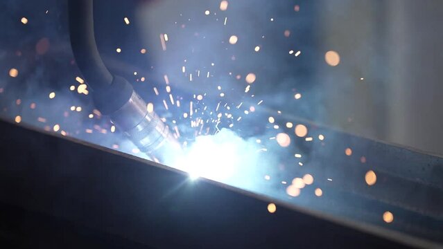 Sparks from the welding process. Close-up view of iron welding sparks. iron welding process that produces sparks