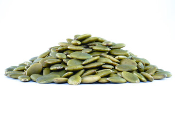 Heap of green pumpkin seeds concept background
