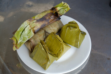 Delicious Traditional Southeast Asian Desserts Neatly Wrapped in Banana Leaves, Clean, and Beneficial for Good Health