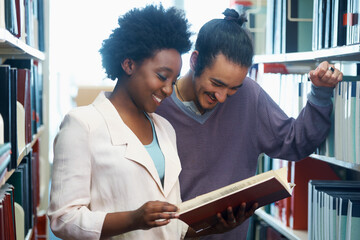 Man, woman and friends at library or reading book together as students for education, research or learning. University, pupils and literature in USA college for degree exam, collaboration or test