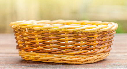 Wicker basket for bread on table on sunlight