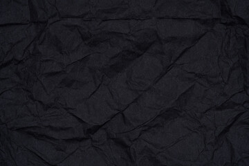 Crumpled Black Paper Textured Background.