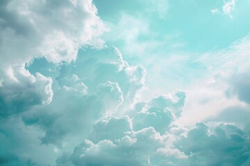 A photo capturing a clear blue sky adorned with numerous white clouds floating calmly, Soft, pastel clouds on an aquamarine sky, creating a dreamy ambience, AI Generated