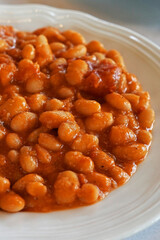 Close up 'Fagioli Alluccelletto' Tuscan baked beans braised in Tomato and Sage sauce