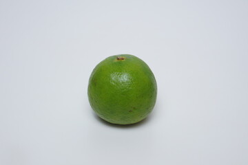 a raw lime flat lay on a white background
