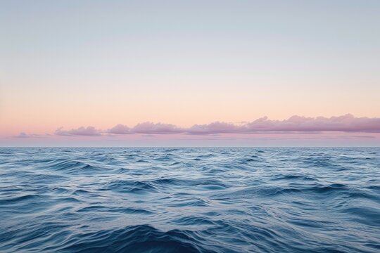 An aerial photo showing a large expanse of water with clouds floating in the blue sky above, Subtle hues of a dusk sky over an open ocean, AI Generated