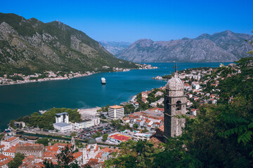 Fototapeta na wymiar View of Kotor bay with the Bell tower of Church of Our Lady of Remedy on the slope of Saint John mountain