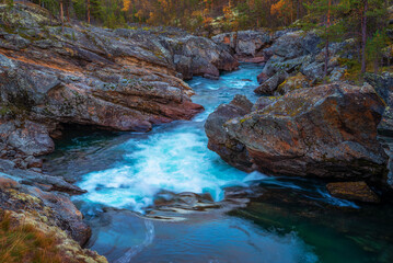 Ridderspranget rapids in Jotunheimen National Park, Norway, with vivid rock formations....