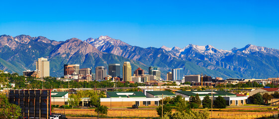 Fototapety  Skyline of Salt Lake City downtown in Utah with Wasatch Range Mountains in the background.