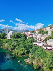 Fotobehang Stari Most View of Mostar from the Stari Most bridge at Neretva river, Mostar, Bosnia and Herzegovina