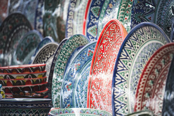 Multi-colored ceramic products with oriental ornaments at the Siab Bazaar in the ancient city of...