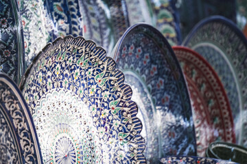 Multi-colored ceramic products with oriental ornaments at the Siab Bazaar in the ancient city of...