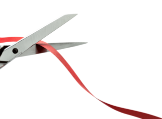 Scissors cutting a red ribbon. clipping path