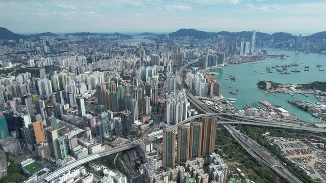 Aerial drone skyview of Hong Kong West Kowloon Victoria Harbour Financial Tsim Sha Tsui Hung Hom Central Admiralty Wan Chai Causeway Bay CBD  financial business