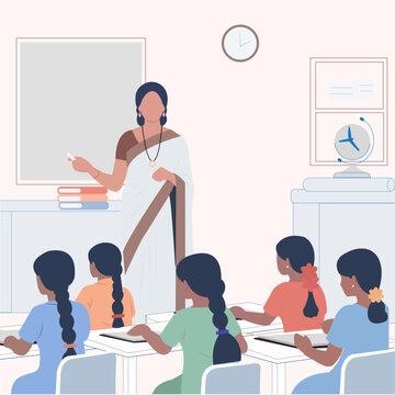 Indian Teacher in a classroom full of students