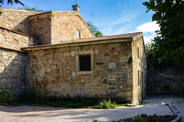 Feodosia, Crimea, Russia - September 26, 2019: Medieval Armenian church of Sergius Sergius (Surb Sarkis) - in Feodosia. Famous artist-painter Aivazovsky is buried in courtyard of church.