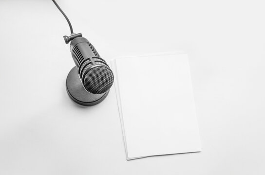 microphone on the table blank sheets of paper