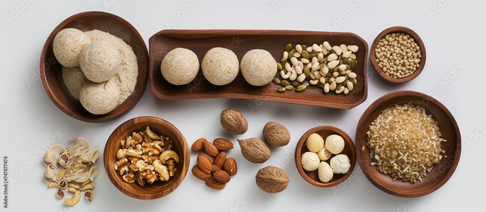 Aufkleber a collection of various nuts and nutshells displayed in rustic wooden bowls. the assortment includes