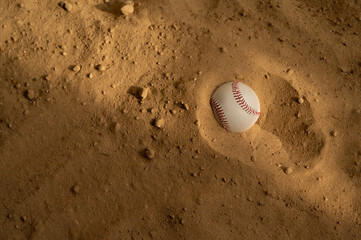 Baseball ball on the sand. Close up